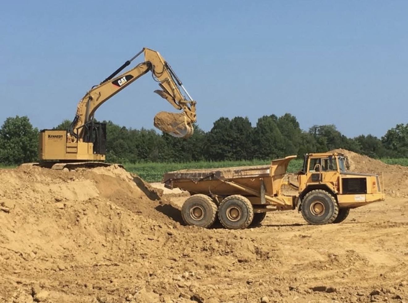 Kennedy CAT excavator loading