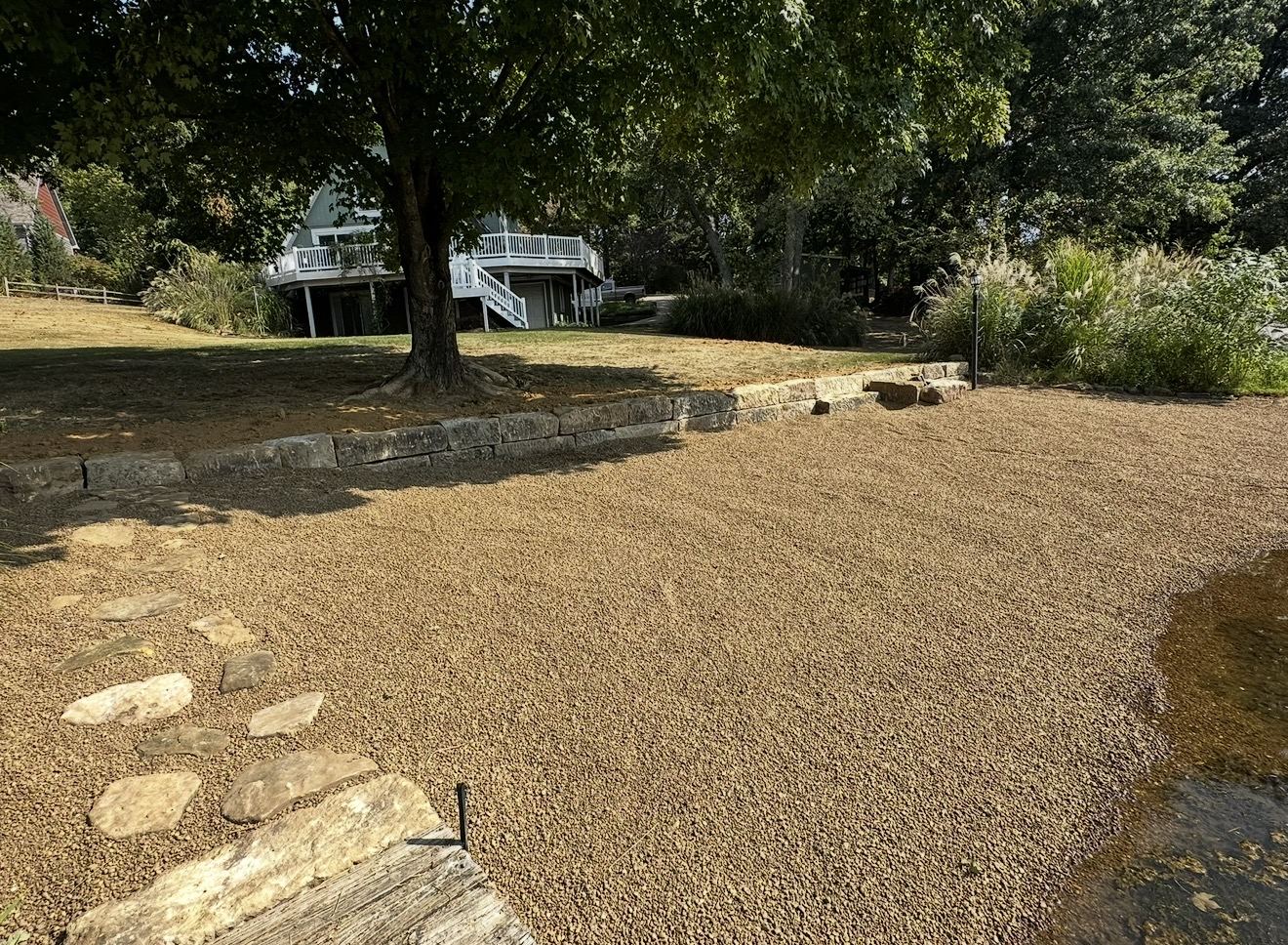 Gravel driveway and retaining wall